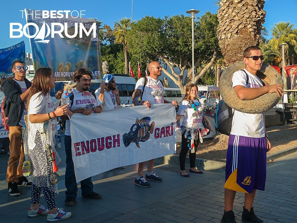 People carrying banners, protesting the new hotel projects at the virgin coves.