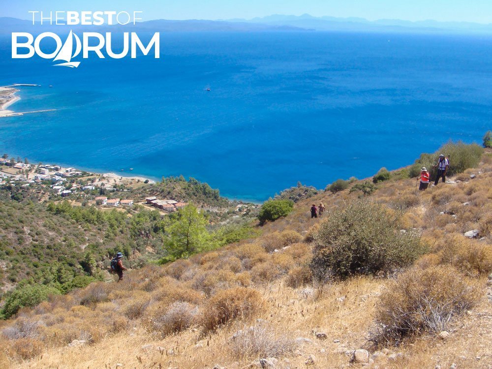 Hikers on the hills of Ören near the Gulf of Gökova, where sun protection and preparation are key for safety in Bodrum.