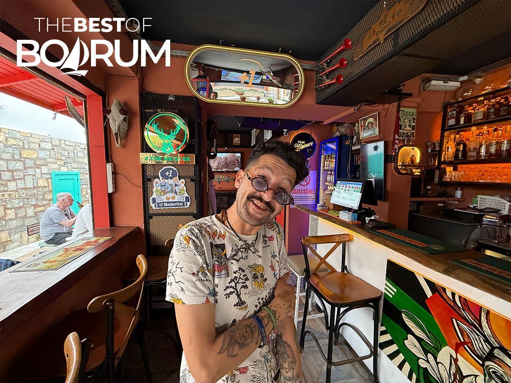 A bartender in a Bodrum bar, reflecting social life included in Turkey travel tips.