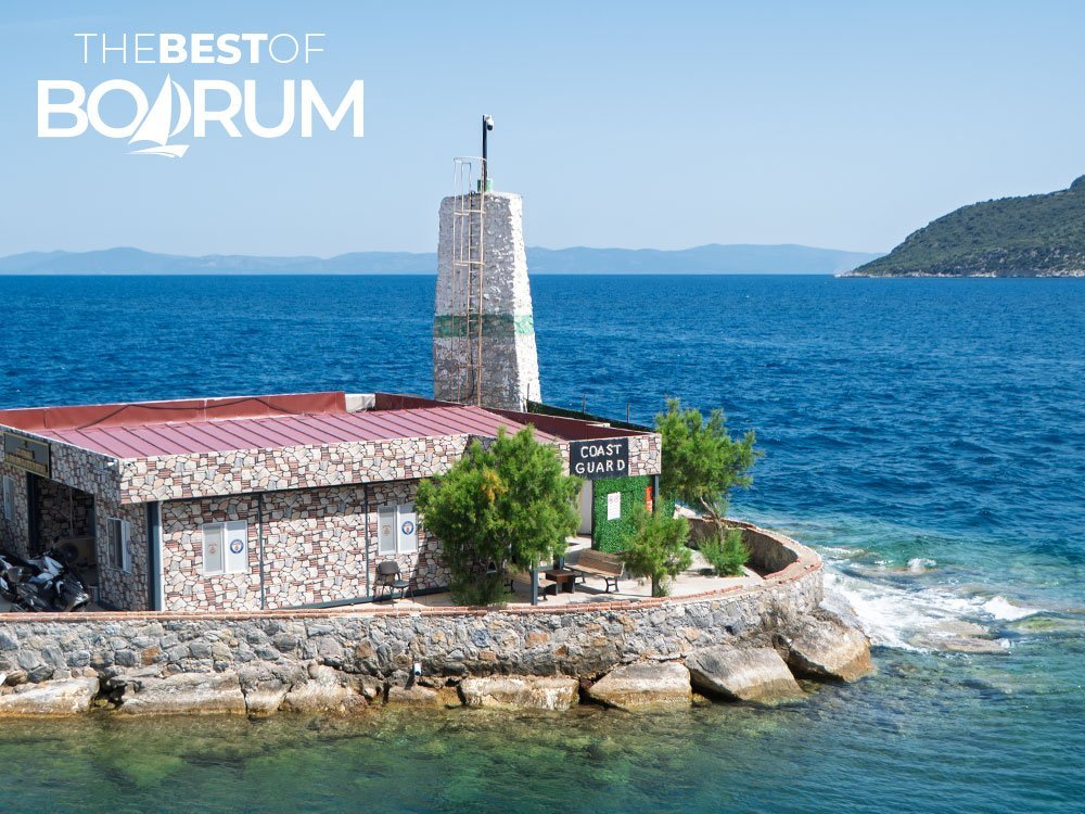 Coast Guard building at Datça ferry port, viewed from the ferry arriving from Bodrum — a glimpse of nearby destinations popular for Aegean day trips.