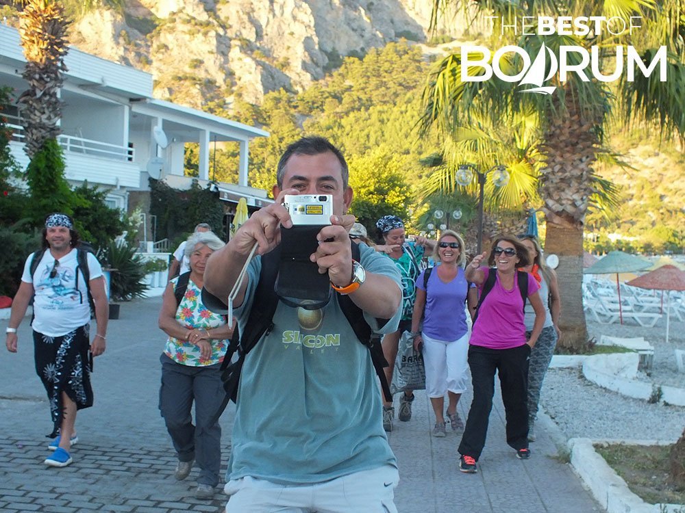 A hiking group arriving in Ören after a trek overlooking the Gulf of Gökova — a joyful moment that captures the spirit of sharing Bodrum experiences.