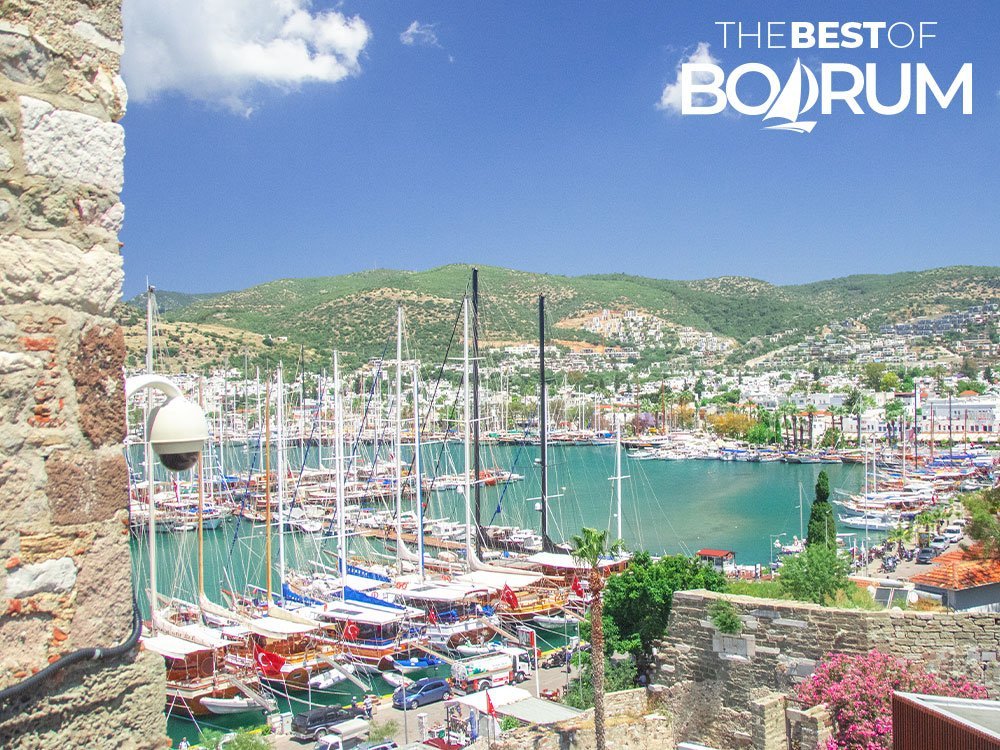 View of Bodrum Turkey from the castle walls, showing the old harbour, boats, and the town centre.
