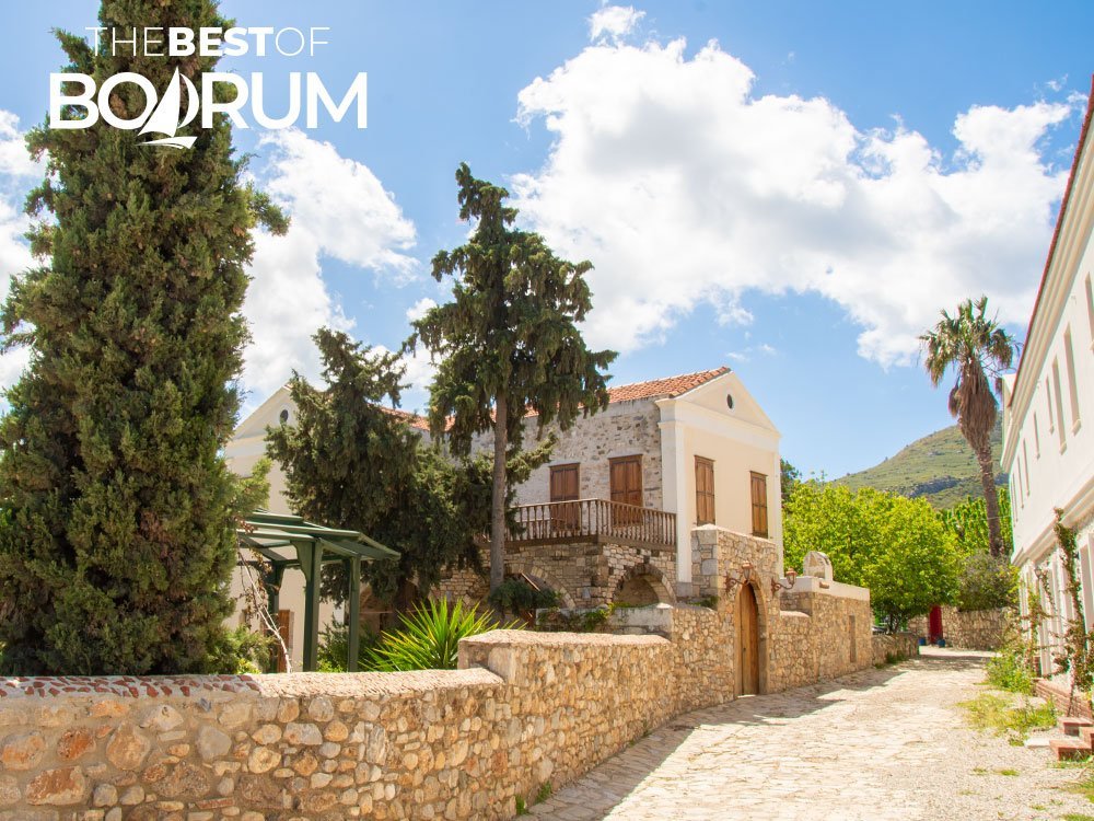 A quiet stone street with old houses in Old Datça.